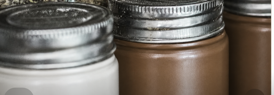 Close-up of assorted metalic jars